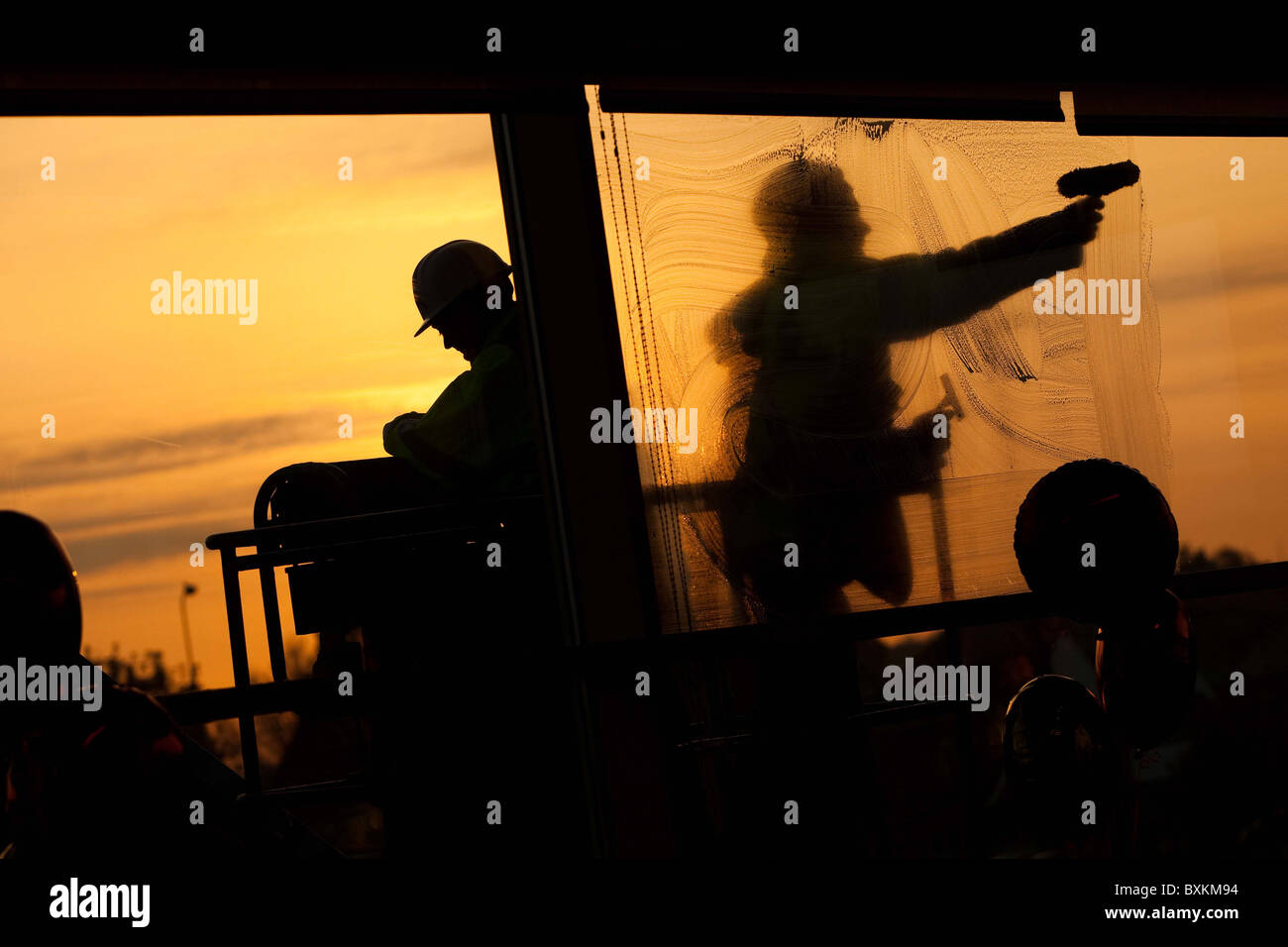 window cleaners cleaning windows Stock Photo