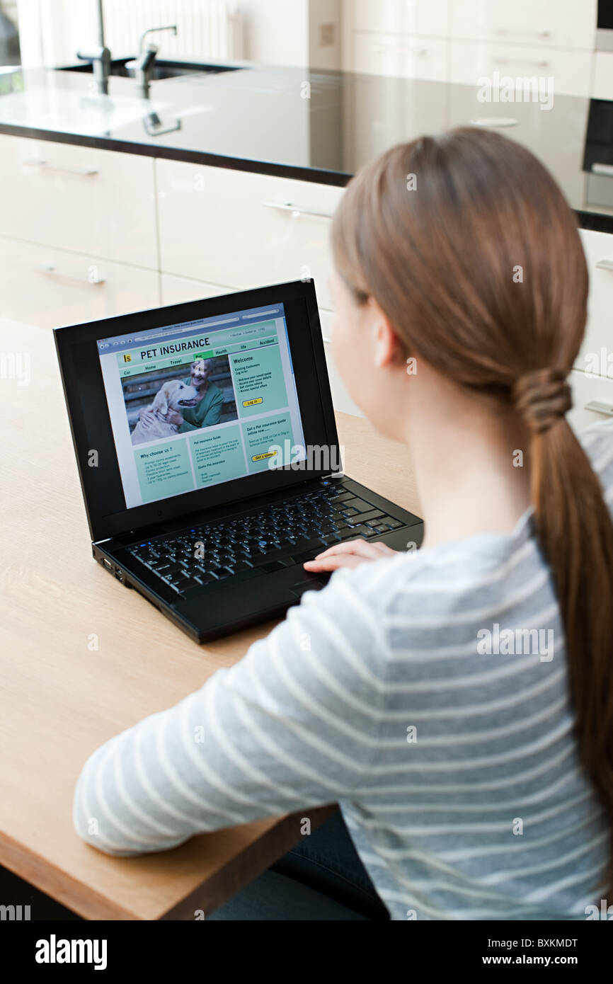 Young woman using laptop Stock Photo - Alamy