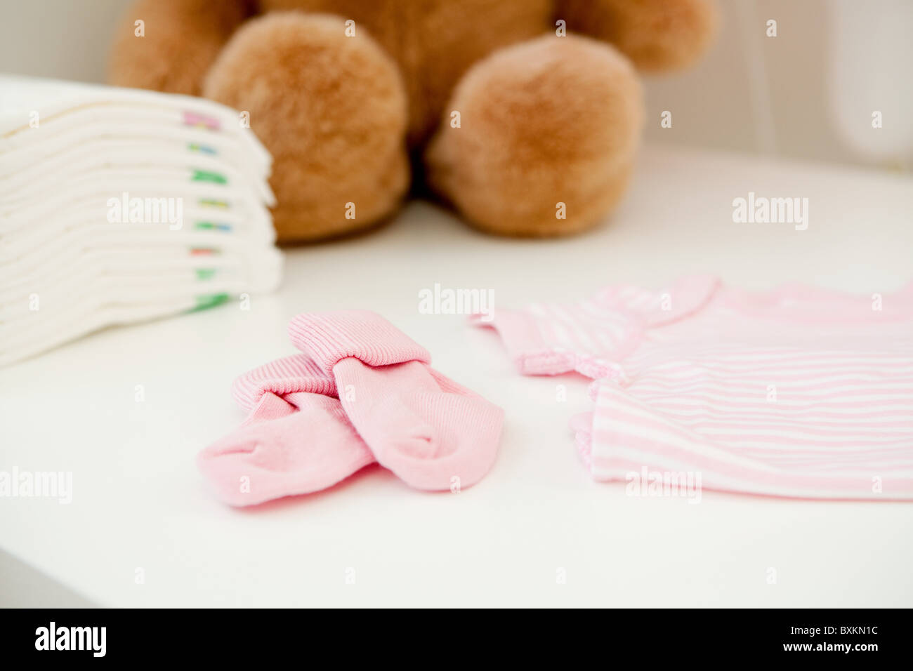 Baby clothes and bear Stock Photo