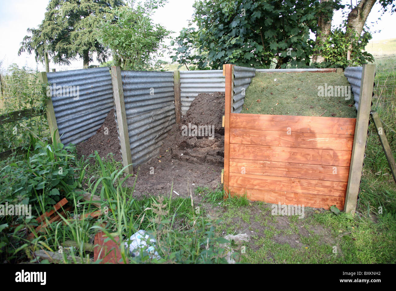 A three bin compost heap Stock Photo Alamy