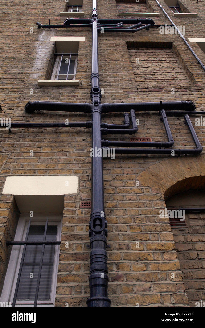 Cast Iron drainpipes and guttering on a Victorian building London UK