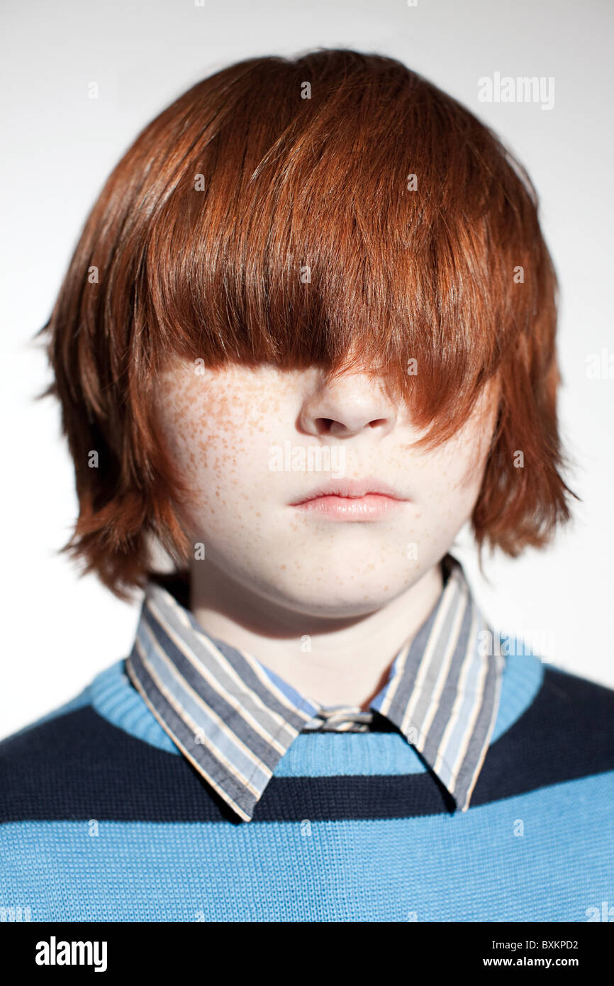 Boy with hair covering his eyes Stock Photo
