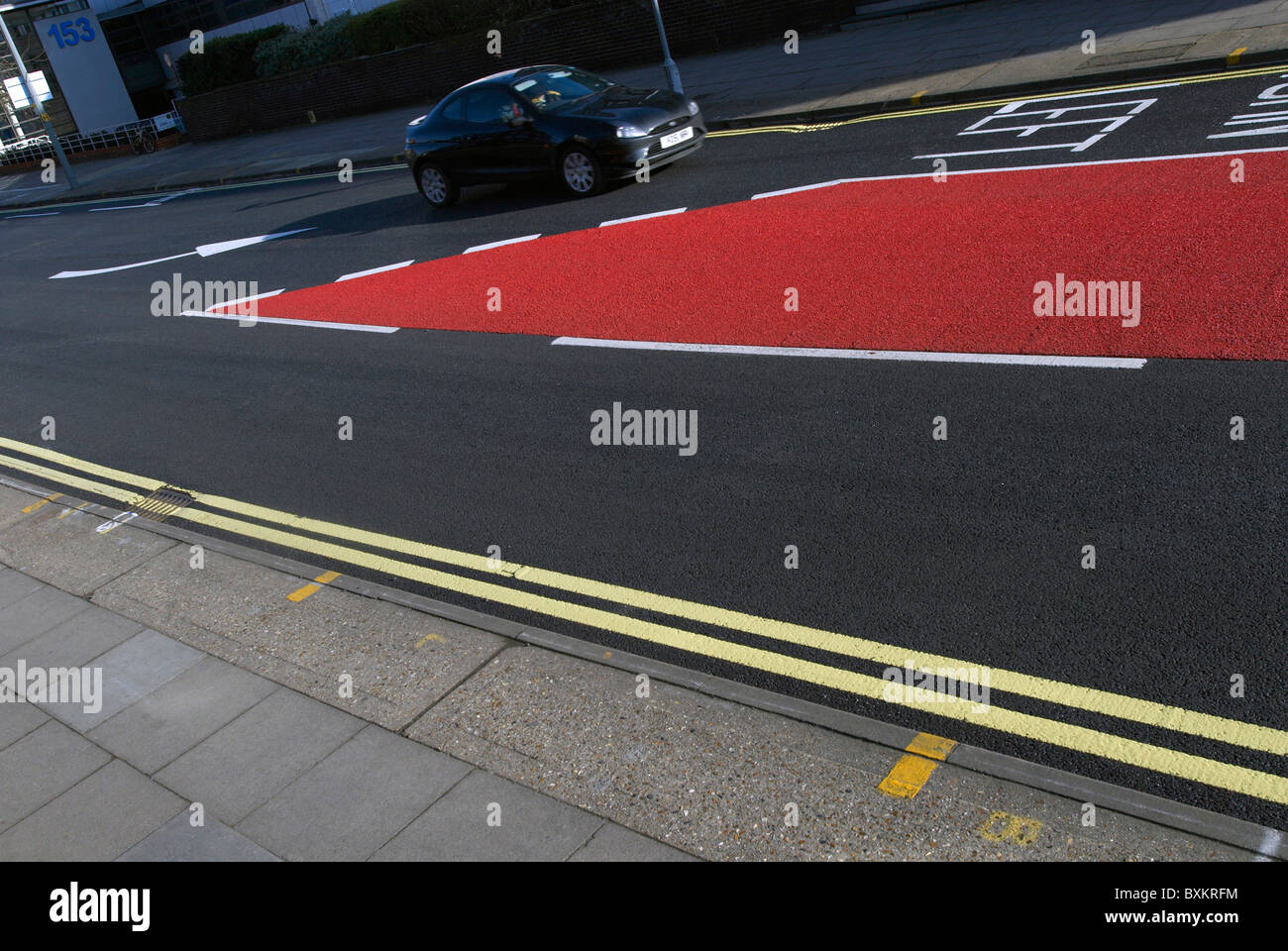 Road markings and coloured asphalt bus lane Ipswich United Kingdom Stock Photo