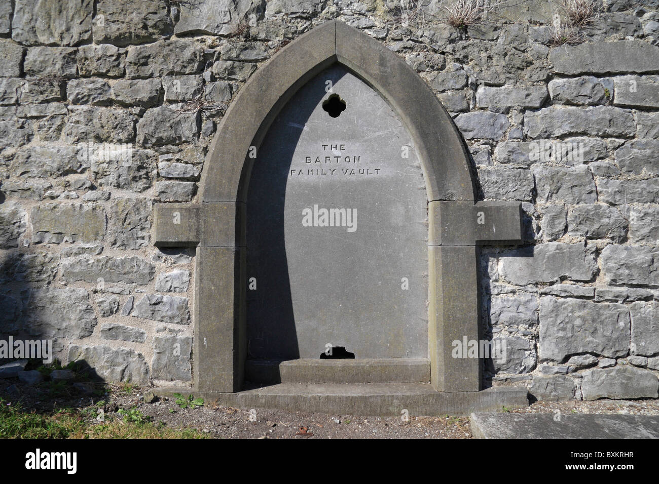 Tomb entrance in the Holy Trinity Church of Ireland church graveyard, Fethard, County Tipperary, Ireland (Eire). Stock Photo