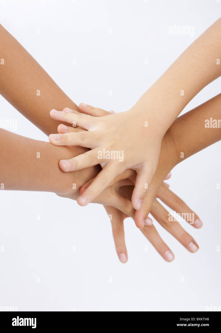 Overlapping hands Stock Photo - Alamy