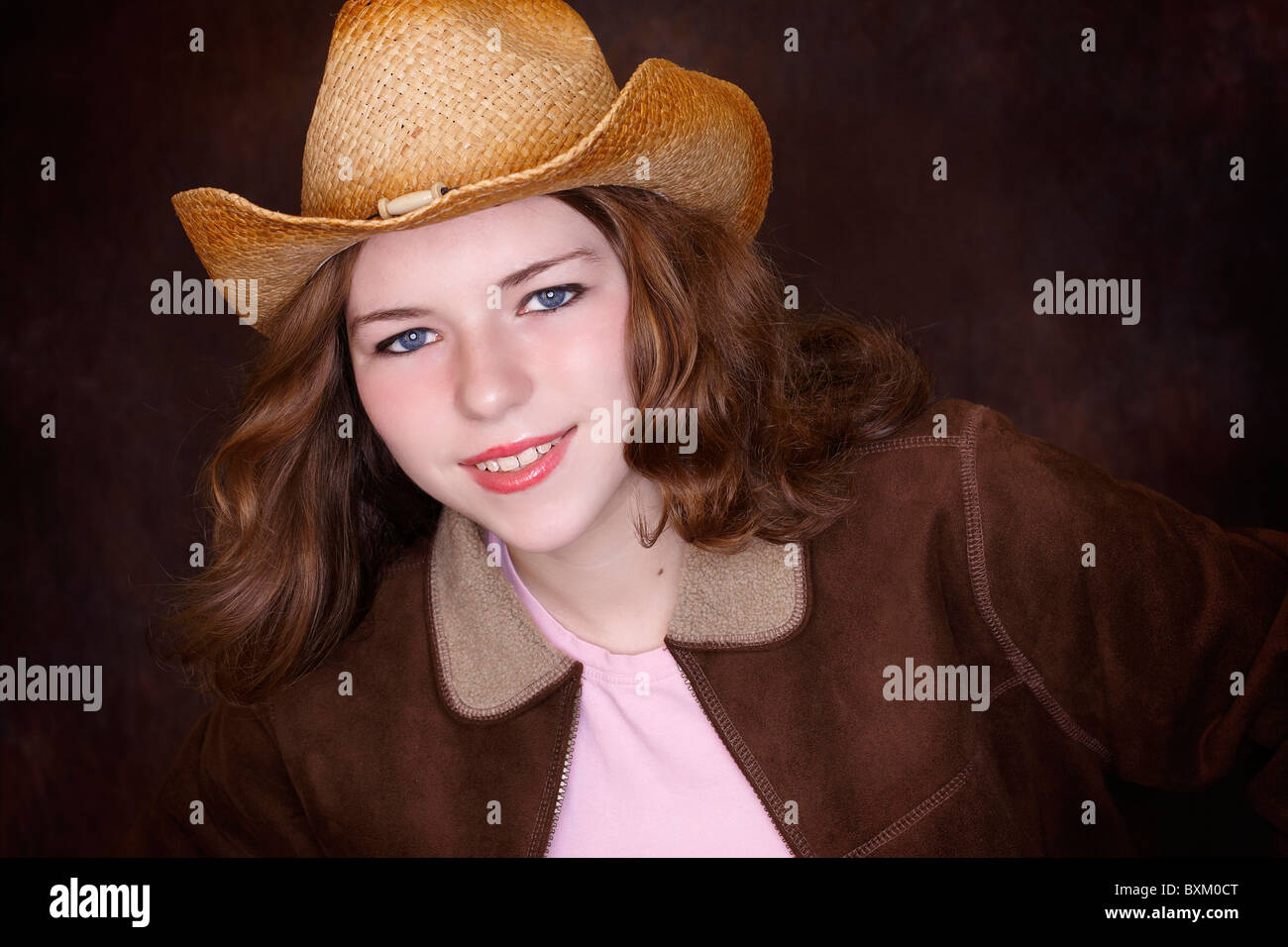Teen girl with cowboy boots and hat Stock Photo Alamy