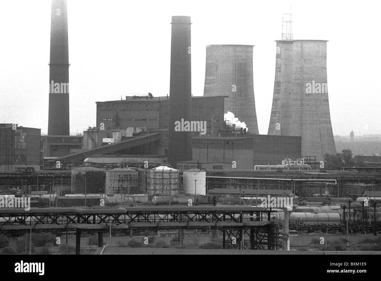 industry,companies,VEB Leuna,chemical plant near Leipzig,East-Germany,14.04.1990,1990s,90s,20th century,historic,historical,state holding combine,chimney,smokestack,chimneys,smokestacks,cooling tower,cooling towers,become obsolete industrial plant,industrial plants,air pollution,exhaust gas pollution,damage to the environment,environmental pollution,pollution of the environment,environmental pollution,ecological damage,contamination,airborne pollutant,airborne pollutants,exhaust emission,pollutant emission,CO2,symbolic,symbolic,Additional-Rights-Clearences-Not Available Stock Photo