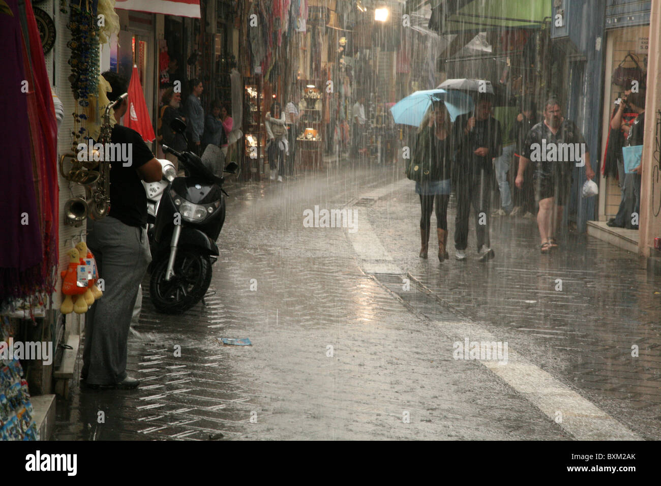 Heavy rain in a shopping area at Ifestou Street in Athens, Greece Stock