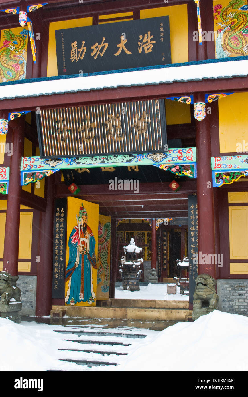 Asia, China, Sichuan, Huanglong NP. Entrance to Huanglong Temple. Snow falling. Stock Photo