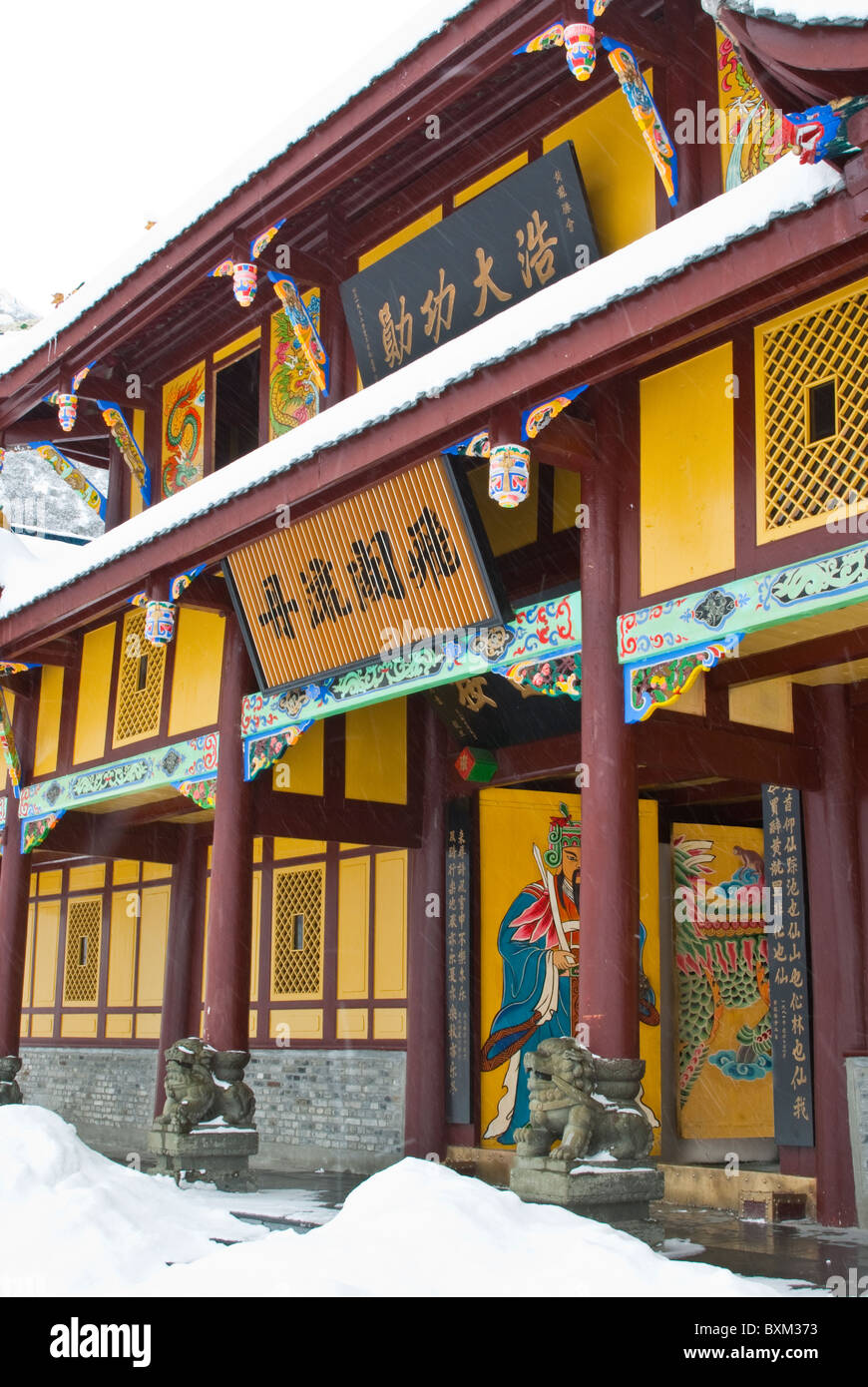 Asia, China, Sichuan, Huanglong NP. Huanglong Temple front. Snow falling. Stock Photo