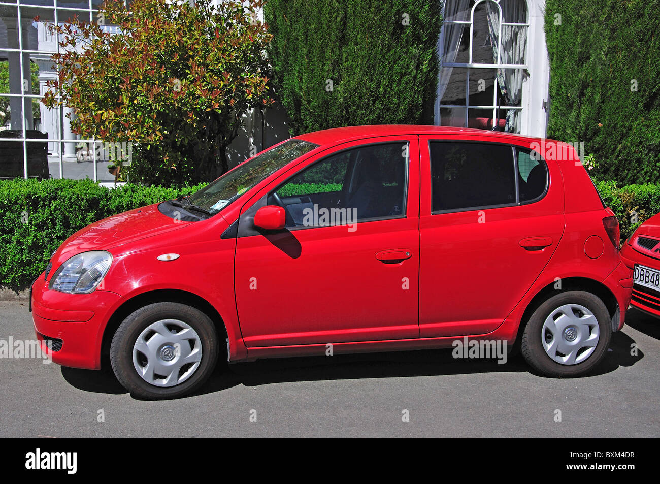 Red Honda Jazz car, Christchurch, Canterbury, South Island, New Zealand Stock Photo
