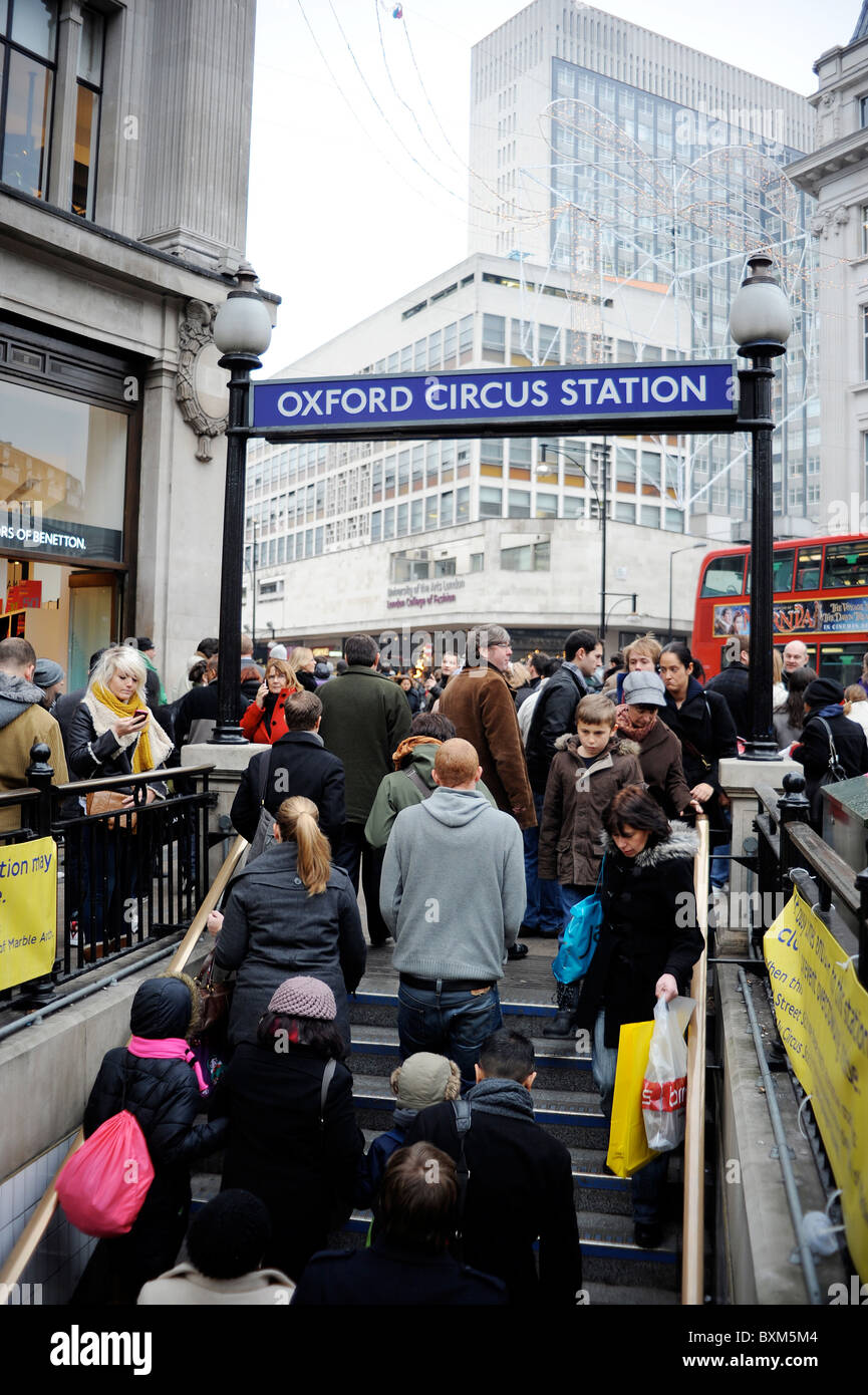 Shoppers at the entrance of Oxford Circus Underground Station, West End, London Stock Photo