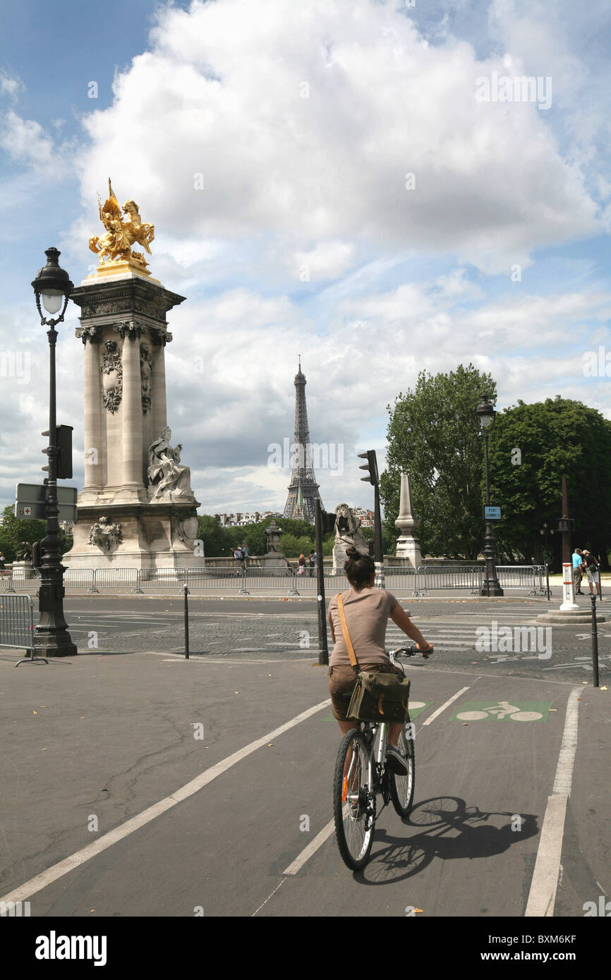 Cyclist on Paris Bicycle Path Near Pont Alexandre Stock Photo