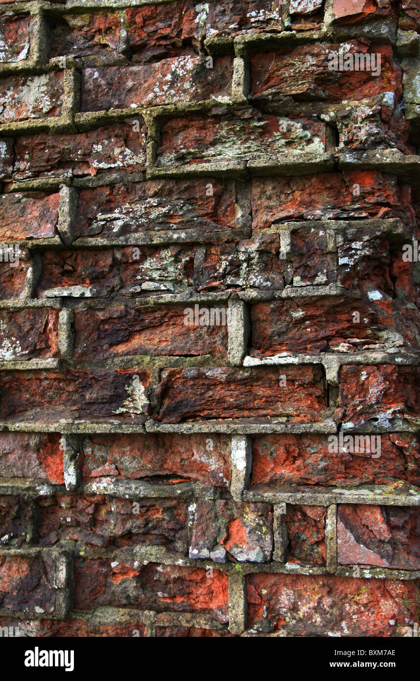 Red bricked farm building, cow shed,stable etc. Old building, needing extra support to maintain the walls, insert the buttress's Stock Photo