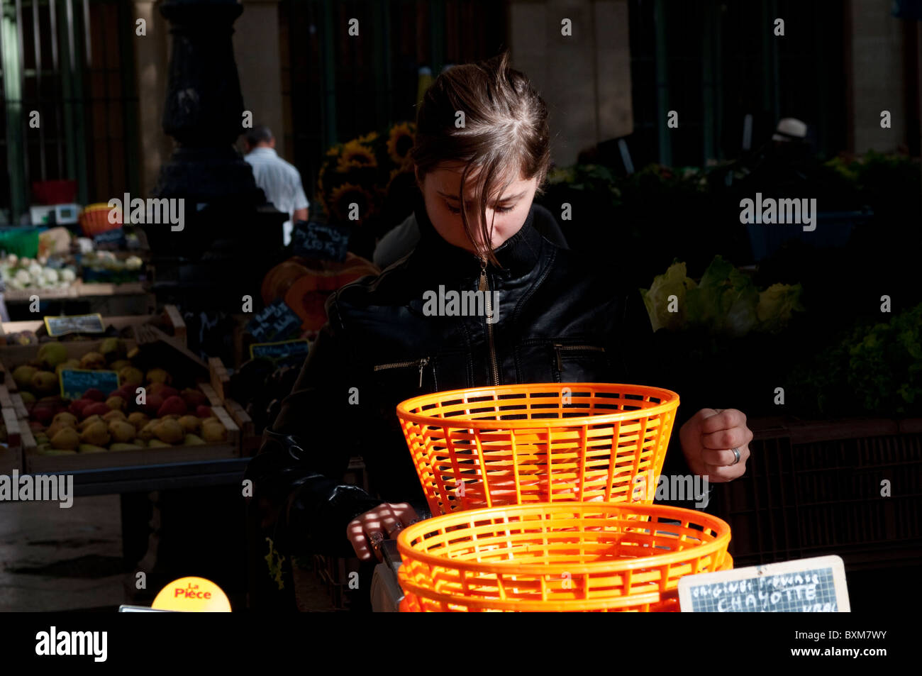 Girl with orange baskets, Market at the Town Hall square, Aix En Provence, France Stock Photo