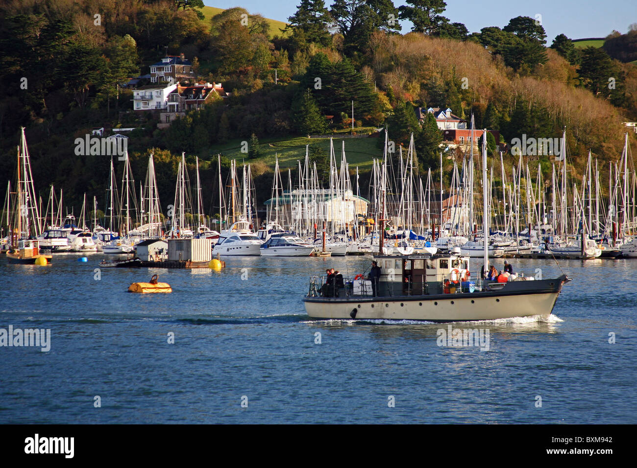 The 'African Queen' a fishing 'hire' boat makes its way down the River Dart past Dartmouth, Devon, England, UK Stock Photo