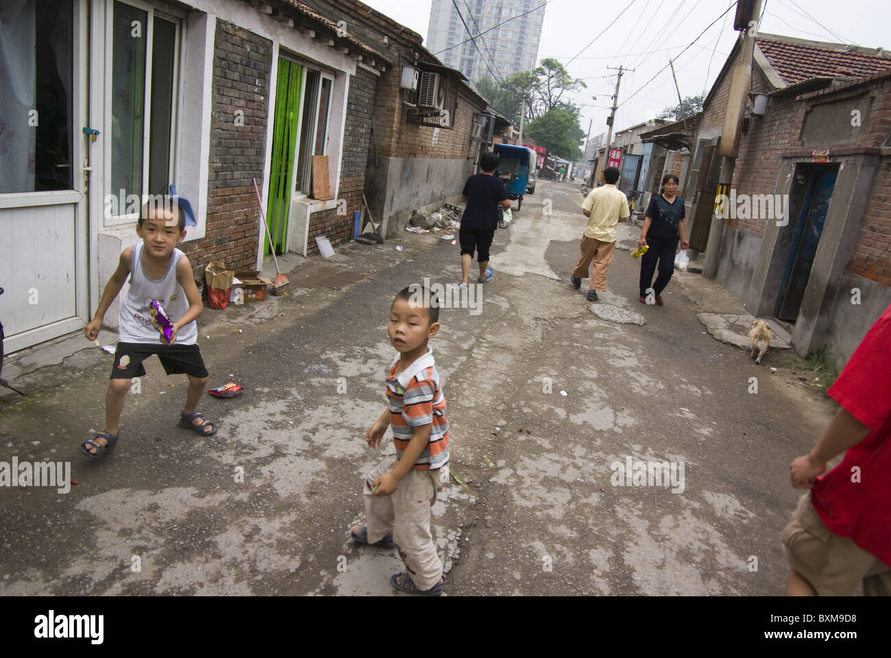 children playing on the street in a poor neighbourhood in beijing,china Stock Photo