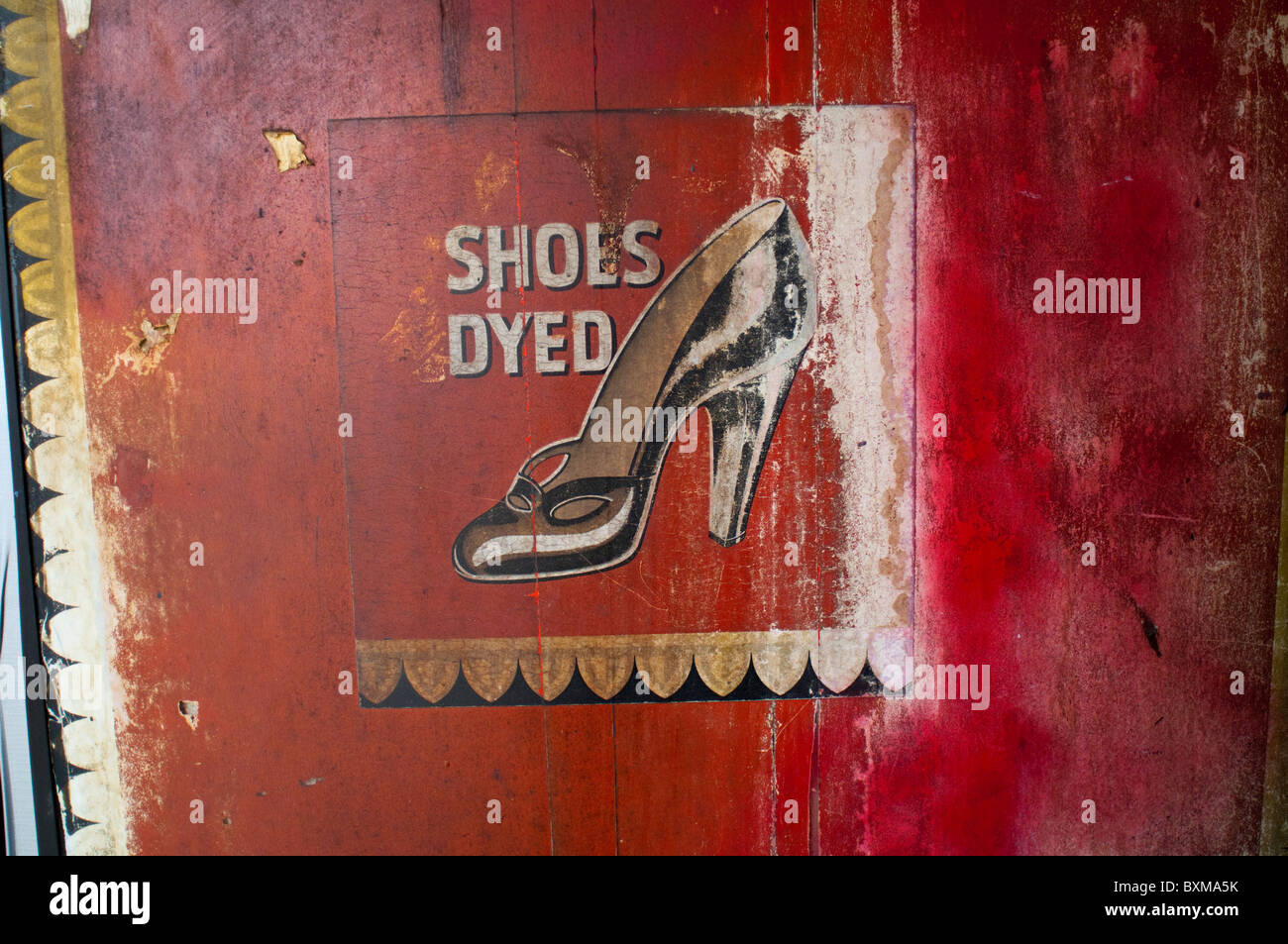 An antique sign outside of a shoe repair store on Madison Avenue in New York Stock Photo