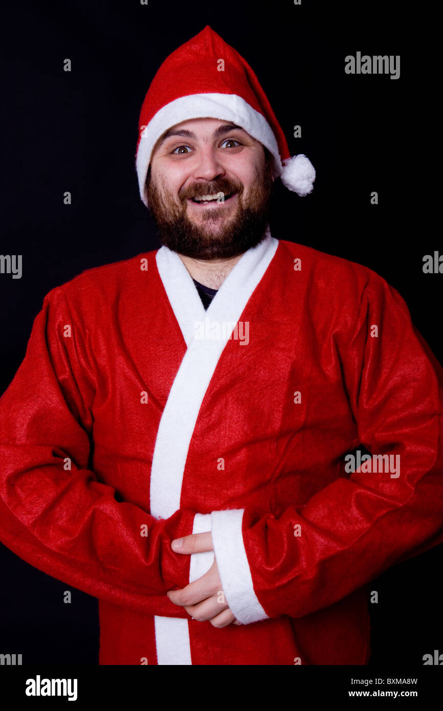 young very happy man dressed as santa Stock Photo - Alamy