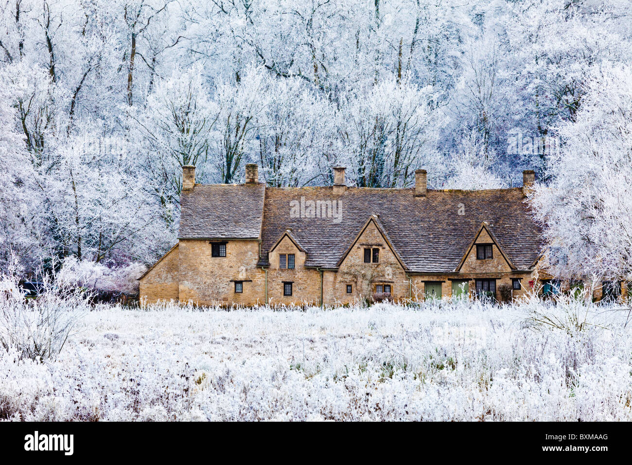 Hoar frost on Arlington Row and Rack Isle in the Cotswold village of Bibury, Gloucestershire UK Stock Photo