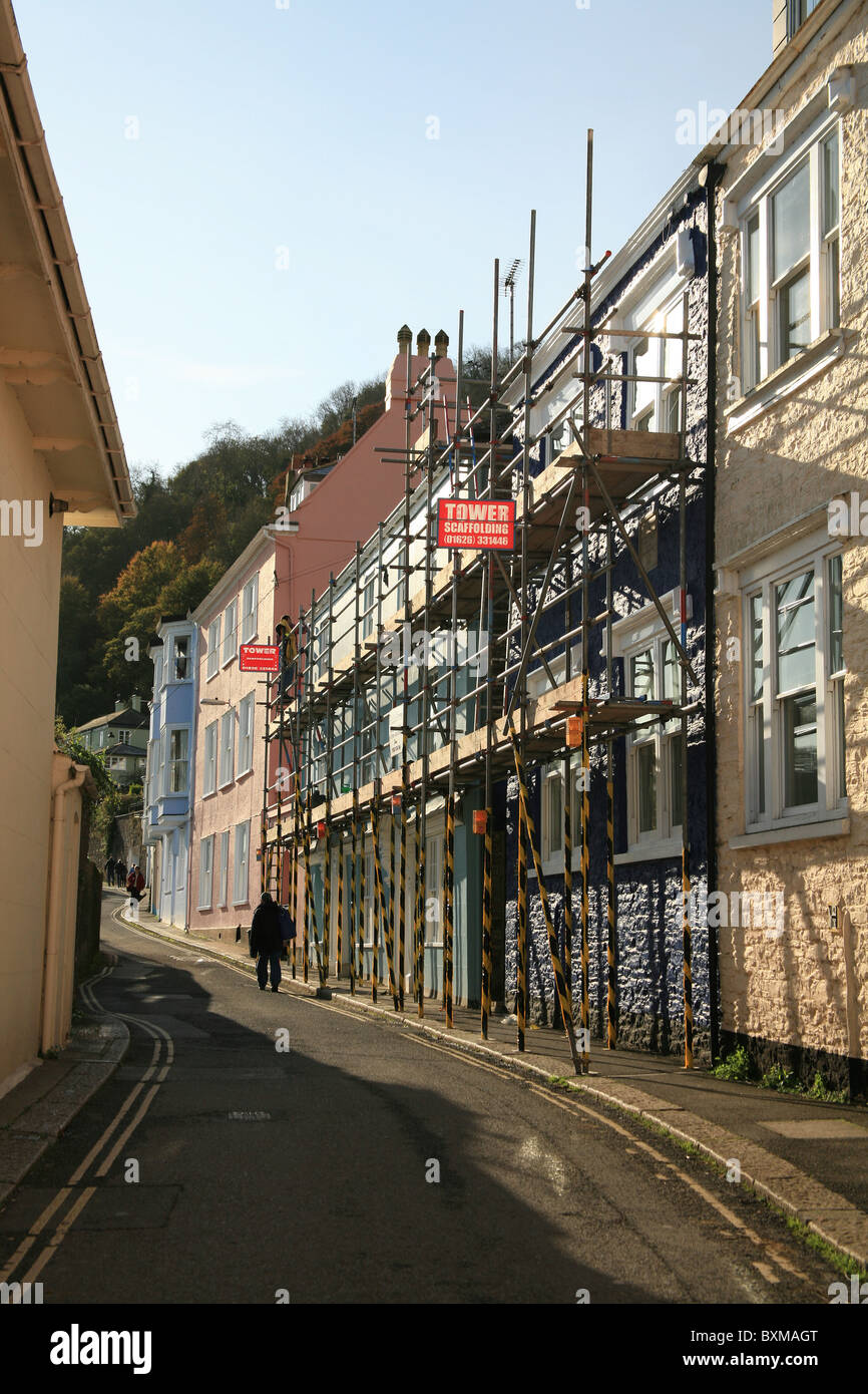 Scaffolding covering an historic terrace of houses in South Town, Dartmouth, Devon, England, UK Stock Photo