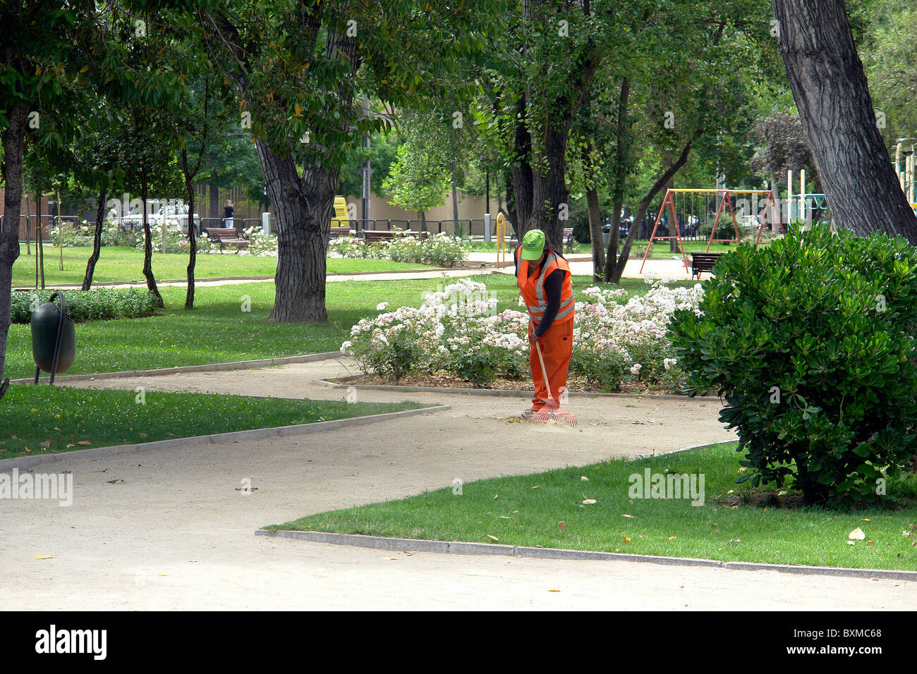 Hardworking woman, gardener of a public park, race Araucanian. Stock Photo