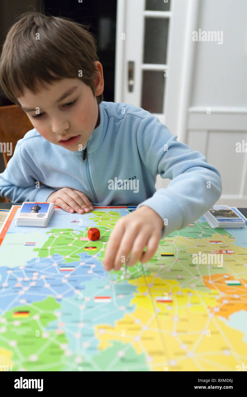 Boy playing a board game Stock Photo