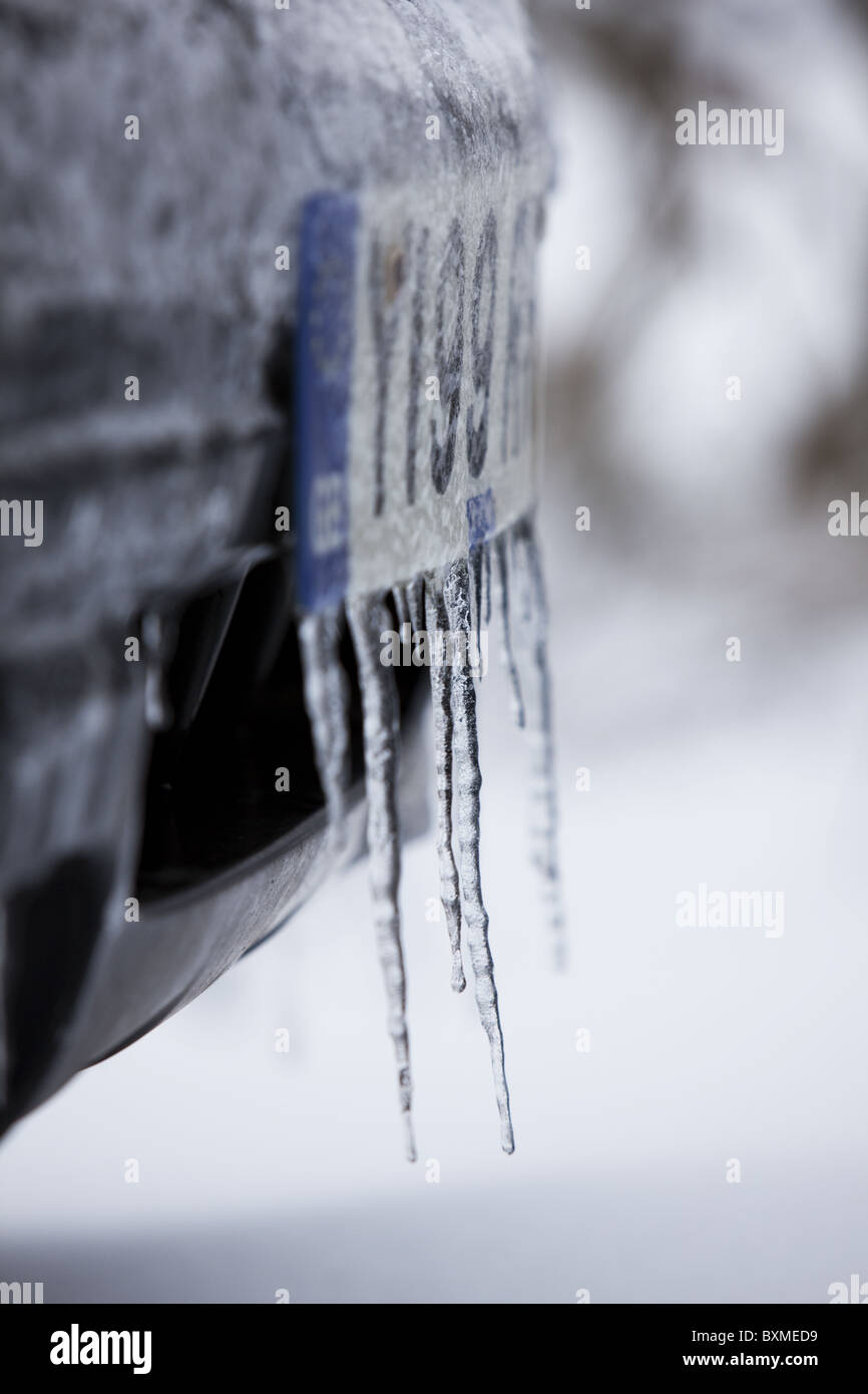 Icicles hanging from a car Stock Photo