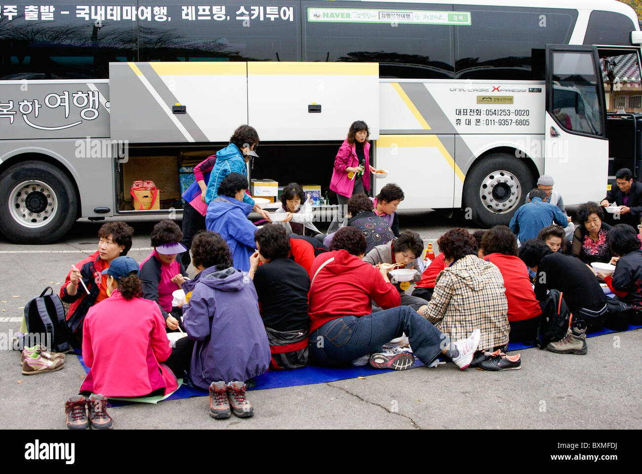Local tourists picnic in parking lot of Unjusa Temple, South Korea Stock Photo