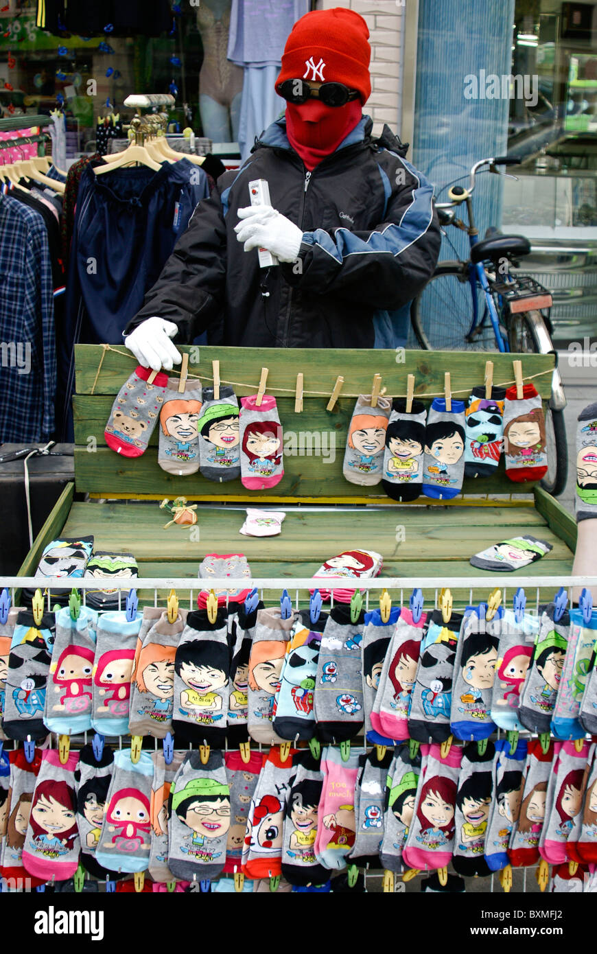 Strange guy selling cartoon socks, Jeonju Hanok Village, South Korea Stock Photo