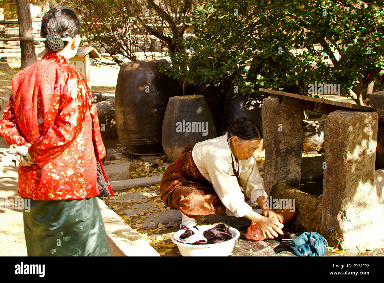 Woman washing clothes, Korean Folk Village, South Korea Stock Photo