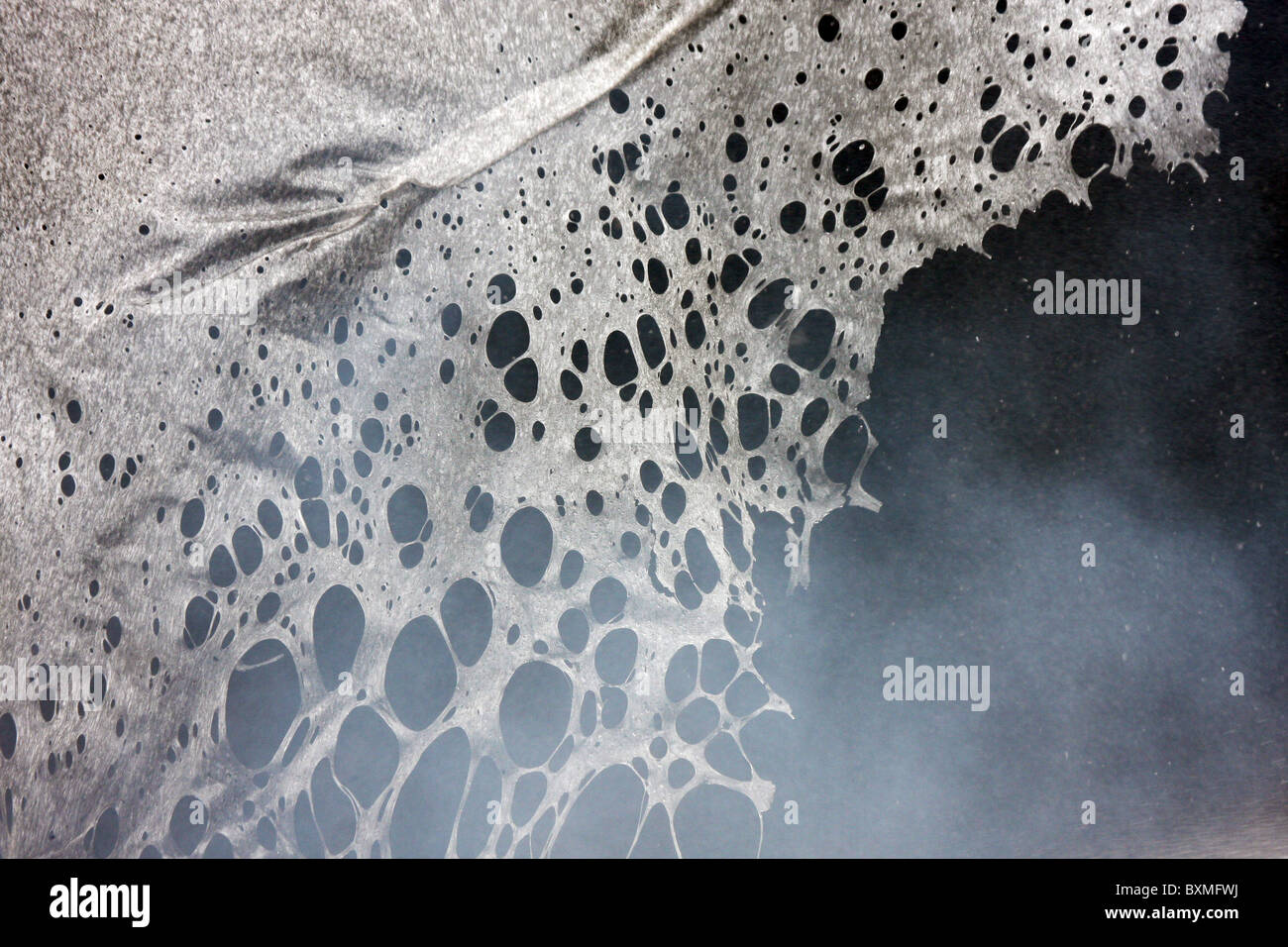 melting plastic in a fire with water spray and smoke Stock Photo Alamy