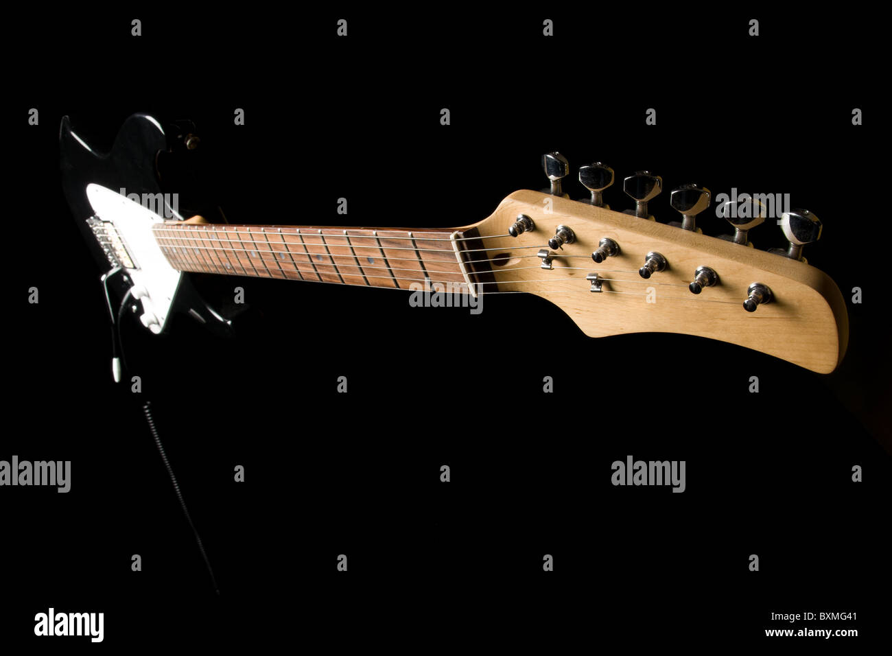 Electric guitar isolated on black background Stock Photo - Alamy