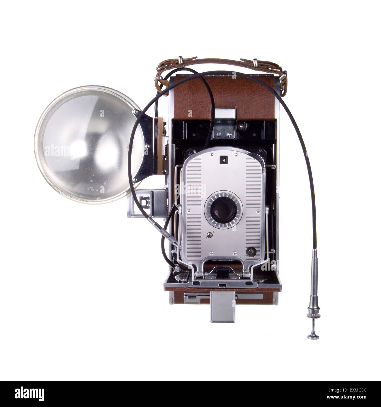 Vintage instant film camera with flash and cable release isolated on white background Stock