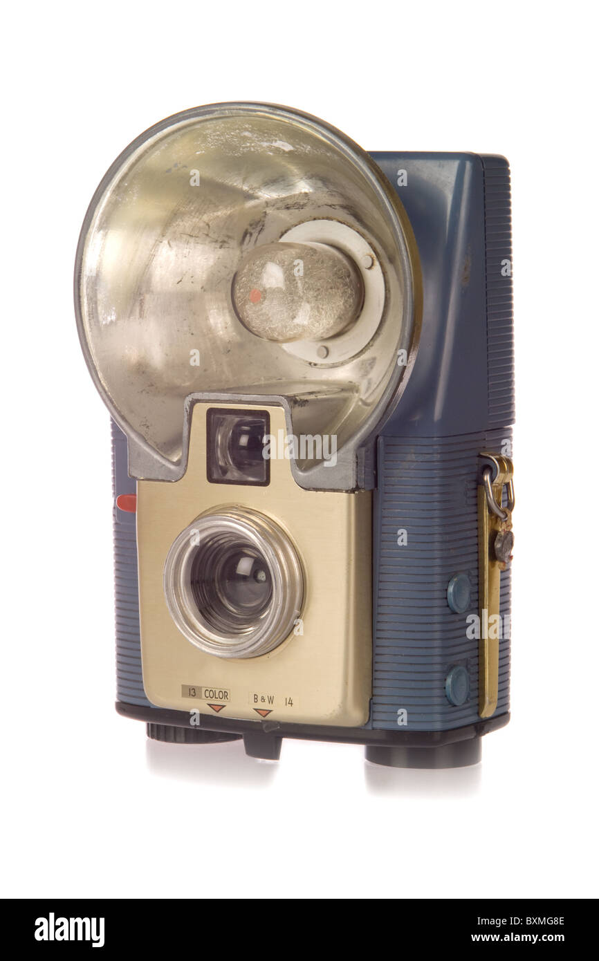 Vintage point and shoot film camera with flash isolated on white