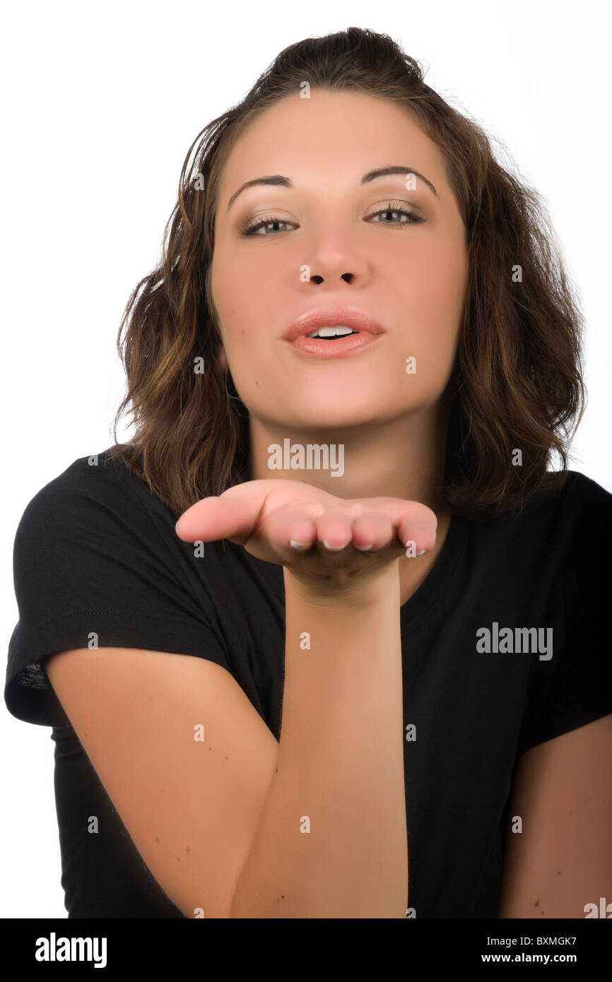 Young woman blowing a kiss Stock Photo Alamy