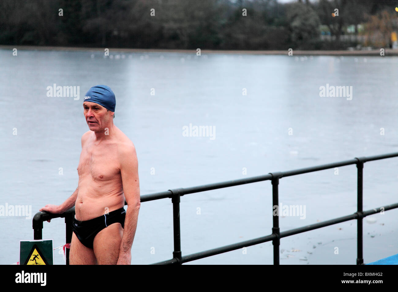A lone swimmer who just out of the freezing cold Serpentine. On Christmas Day 2010 at the Serpentine Swimming Club in Hyde Park, Stock Photo