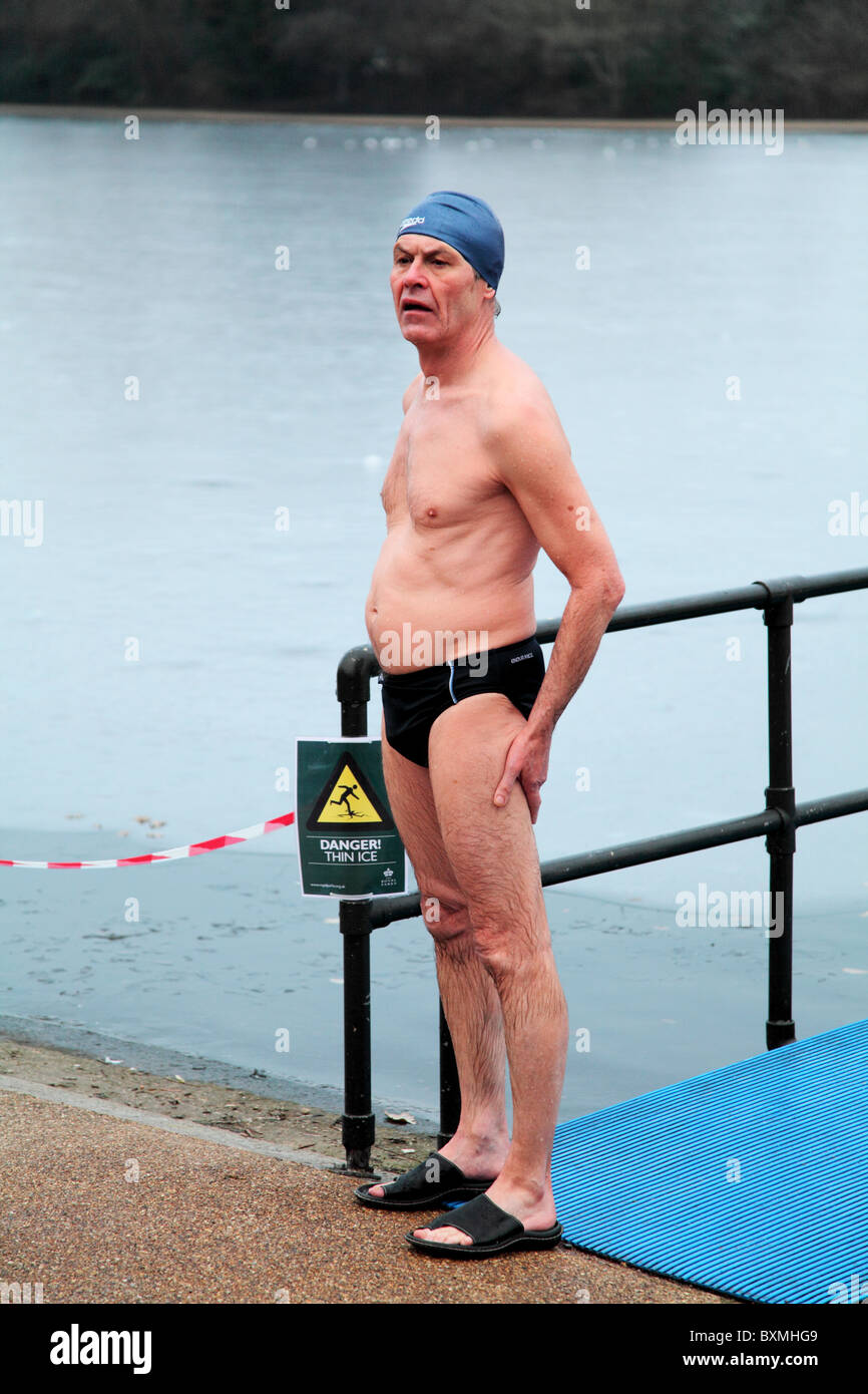 A lone swimmer who just come out of the Serpentine. On Christmas Day 2010 at the Serpentine Swimming Club in Hyde Park, London. Stock Photo