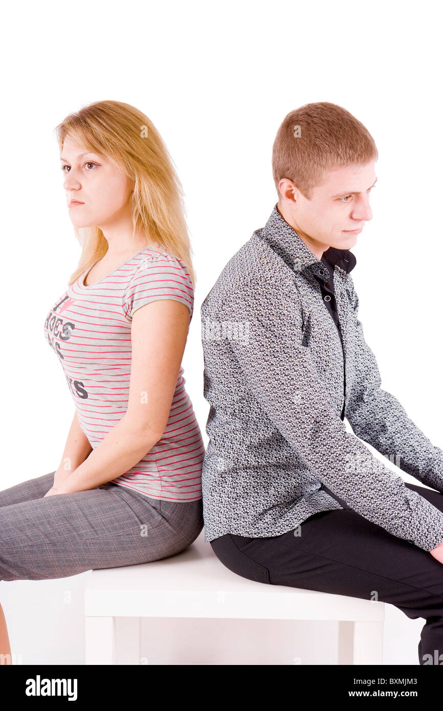 boy and girl sitting on a chair back to back Stock Photo - Alamy