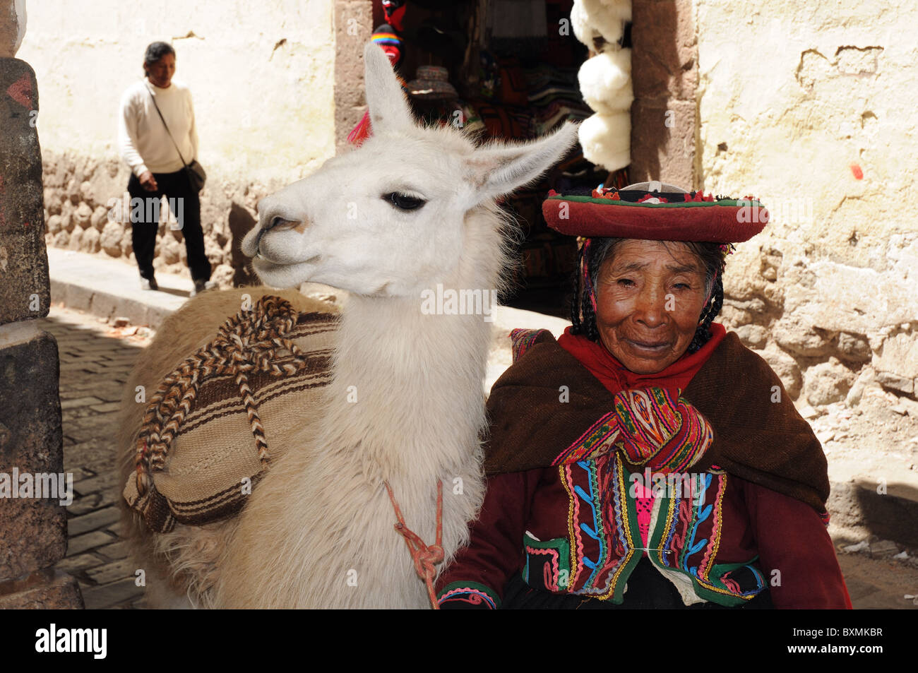 An old woman and her alpaca in Cusco, Peru Stock Photo - Alamy