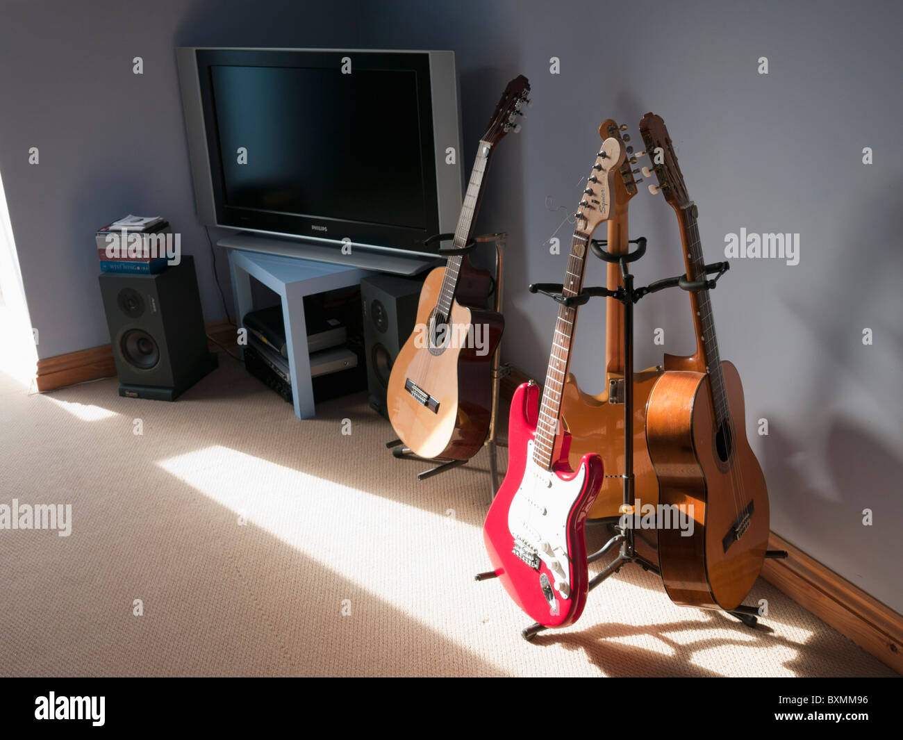 teenagers bedroom with guitars tv and hifi Stock Photo Alamy