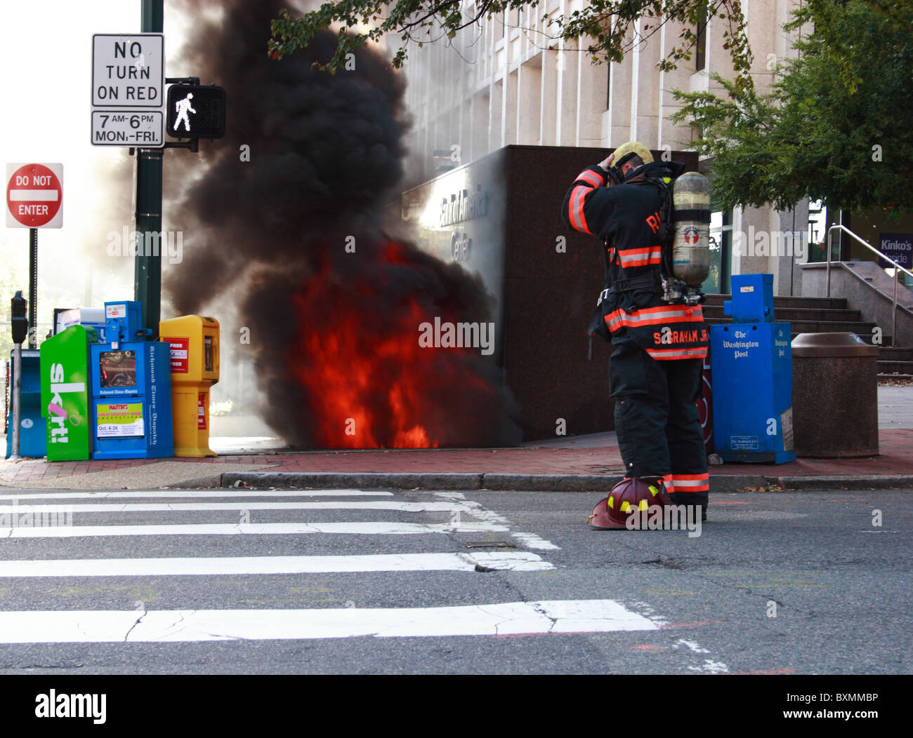 Firemen fighting underground electrical fire and explosion at Bank of
