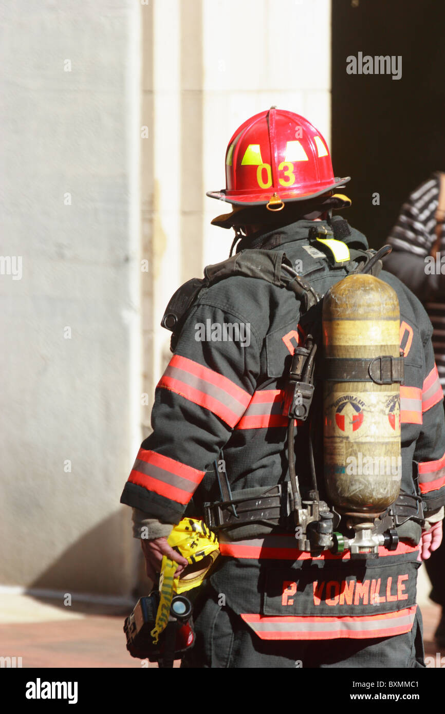 Firemen fighting underground electrical fire and explosion at Bank of
