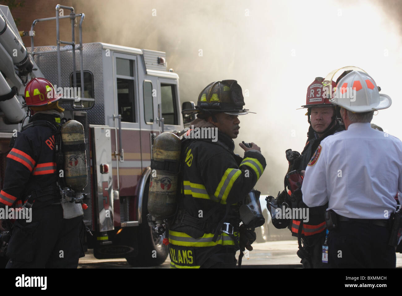Firemen fighting underground electrical fire and explosion at Bank of ...