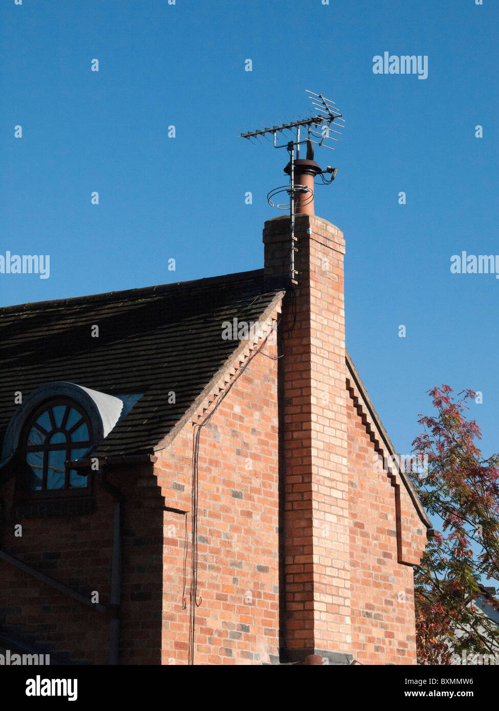 A satellite digital television arial on a roof Stock Photo