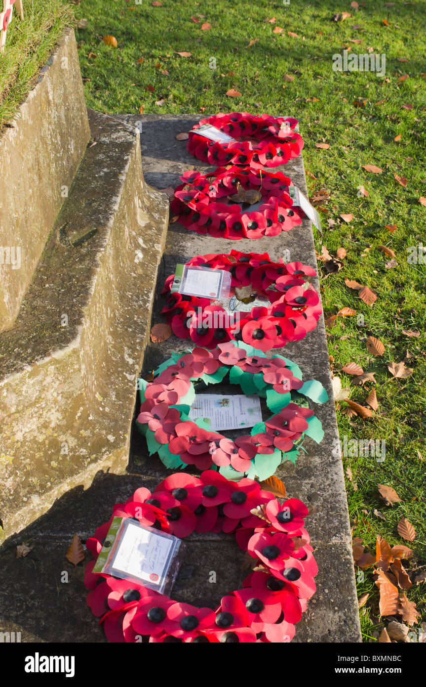 Poppies on crosses commemorating dead soldiers on remembrance day in an English churchyard. Stock Photo