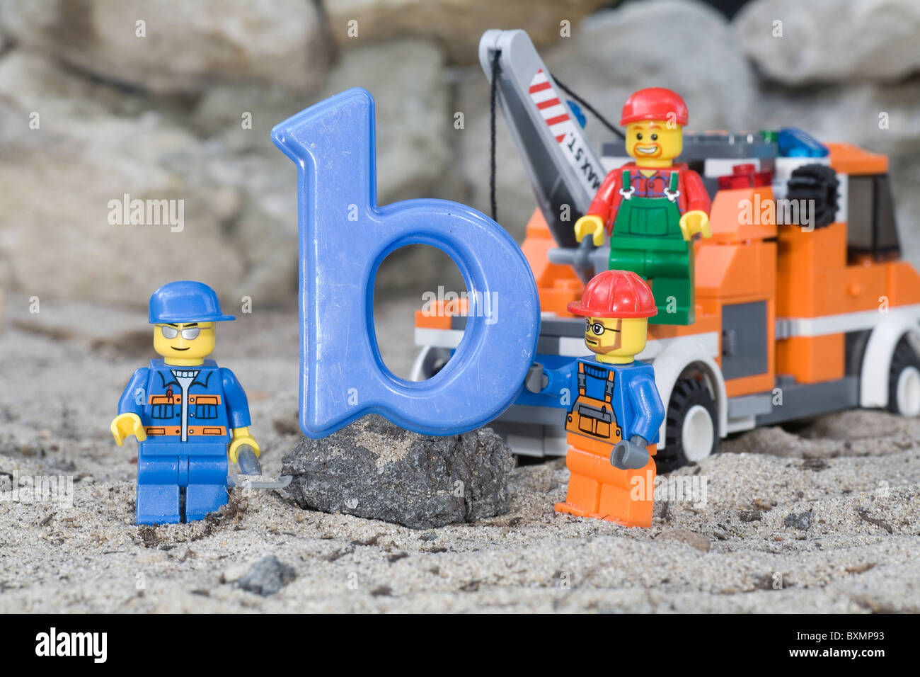 lego workmen constructing with the letter b Stock Photo