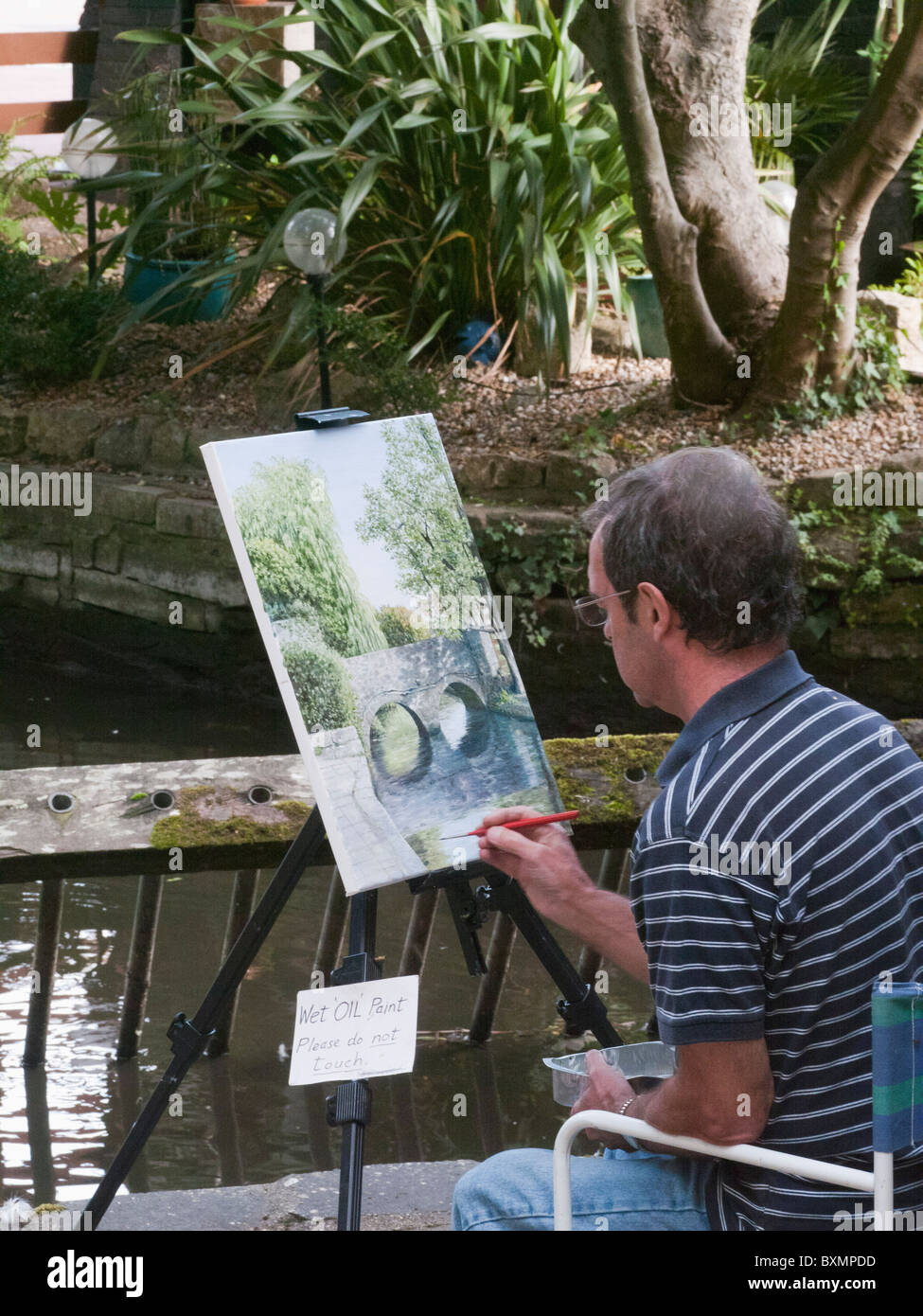 artist painter painting place mill christchurch dorset Stock Photo Alamy
