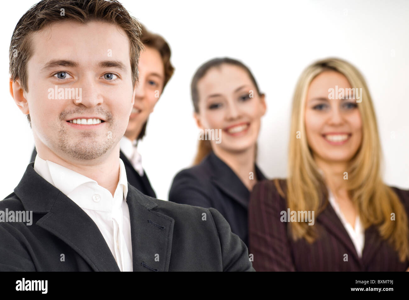 team of successful smiling young business people Stock Photo - Alamy