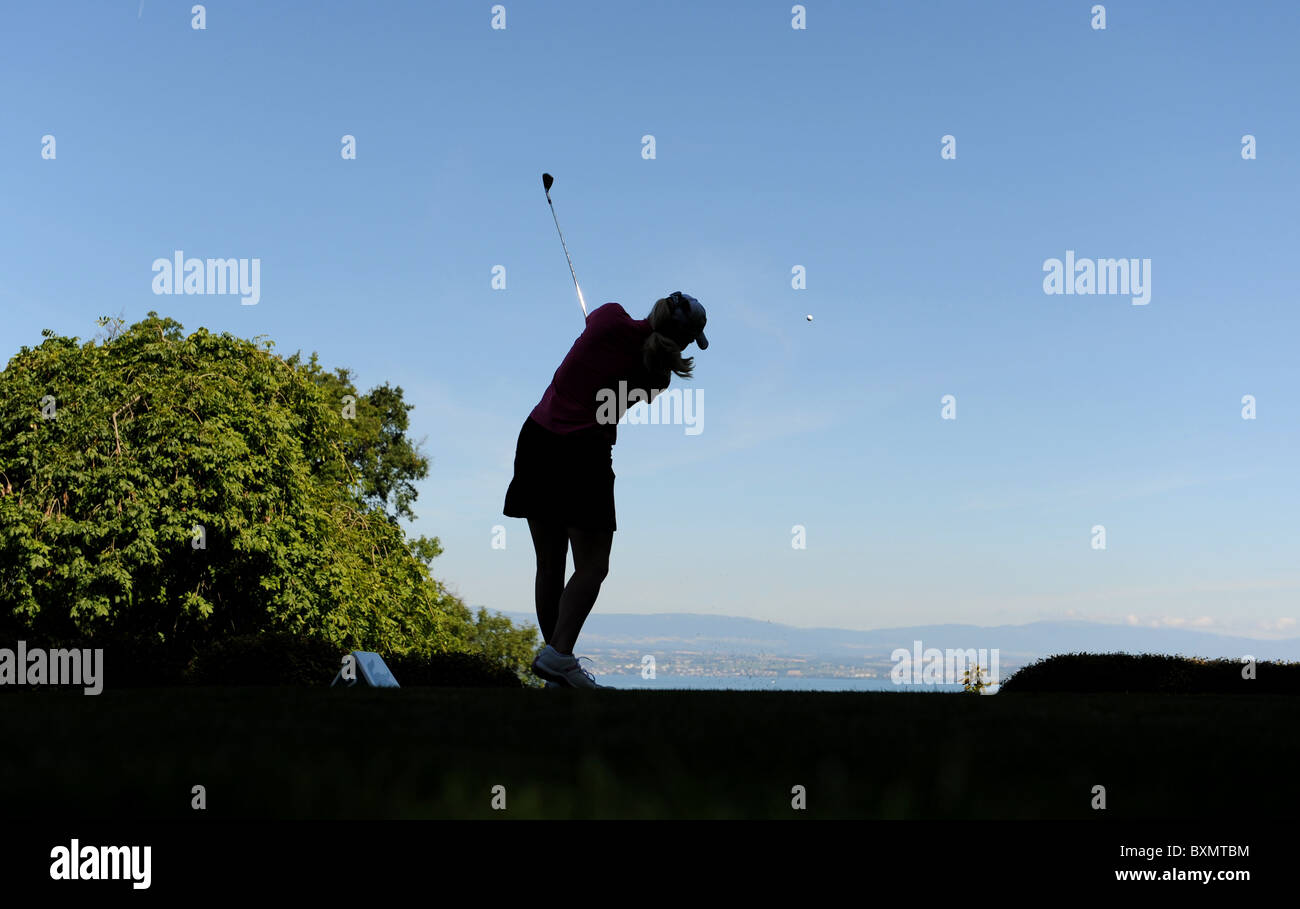 Woman playing golf Stock Photo